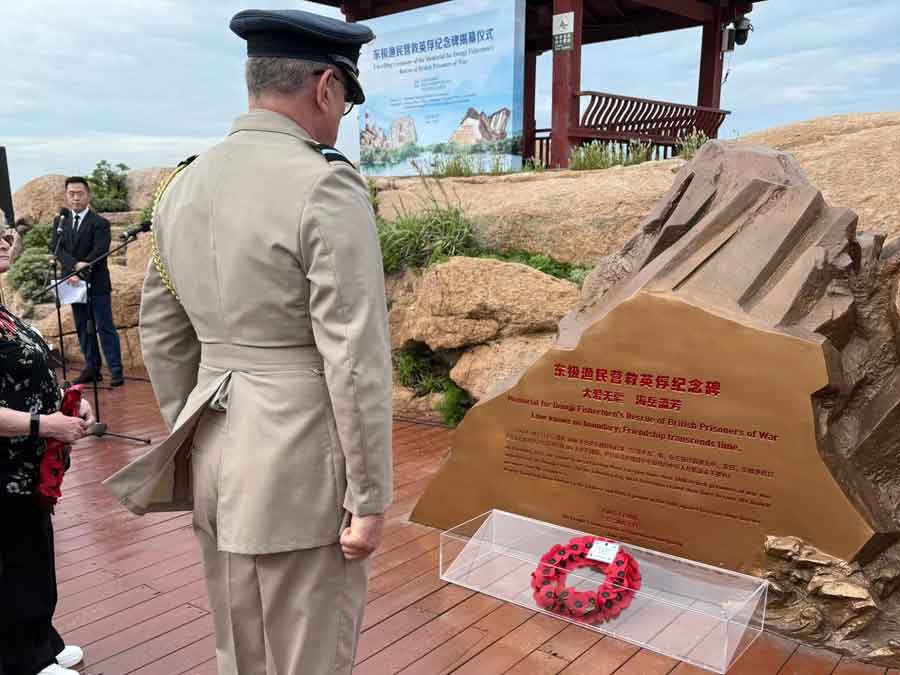 The British Defence Attaché in Beijing, Air Commodore Dom Stamp, laying a wreath at the unveiling of the Zhoushan memorial on 20th May 2025 to commemorate the fishermen who rescued hundreds of POWs from the sinking of the Lisbon Maru in 1942. Photograph courtesy of Kent Shum.
