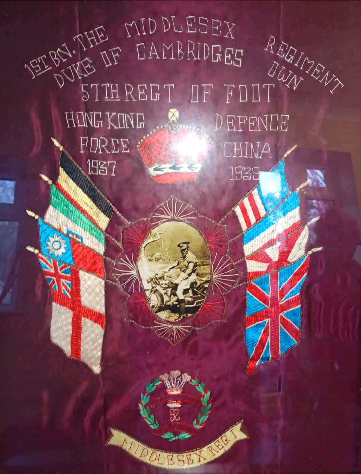 Whilst in Hong Kong Ernest J. Walter Thornton completed an embroidery of the Middlesex regimental flag