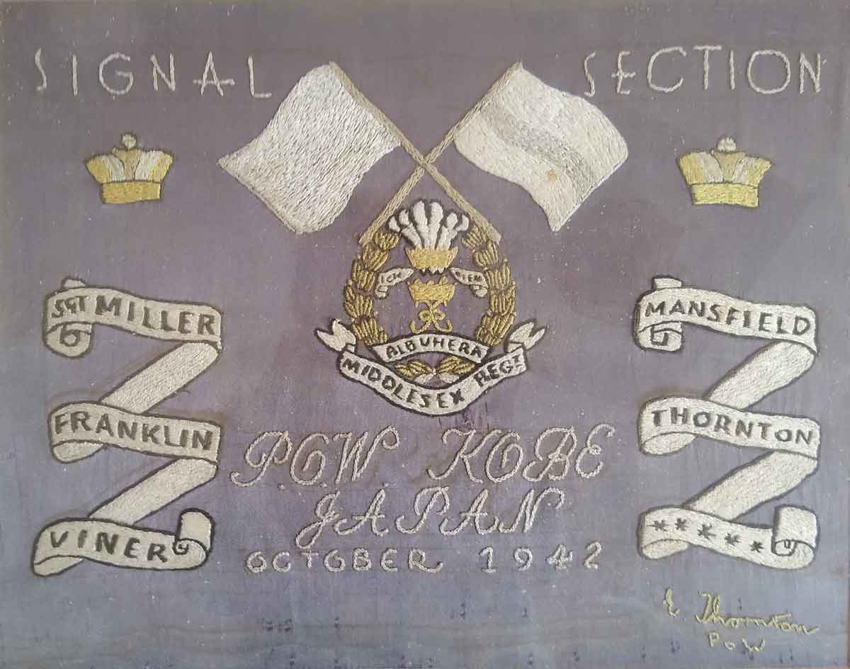 An embroidery of the Middlesex flag created by Ernest J. Walter Thornton while he was in Kobe from 11 October 1942 to 06 September 1945. Ernest was a survivor of the sinking of the Lisbon Maru. 