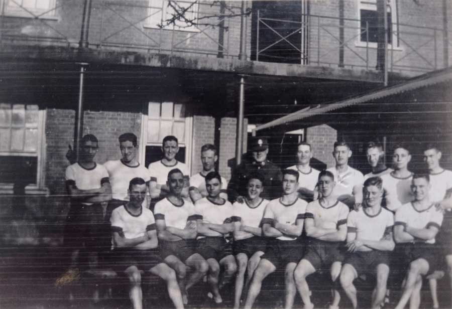 Reverse of this image reads - Middx Regt John [Douglas Haig Weaver] third from R front row. Can you identify any of the other men in this image?