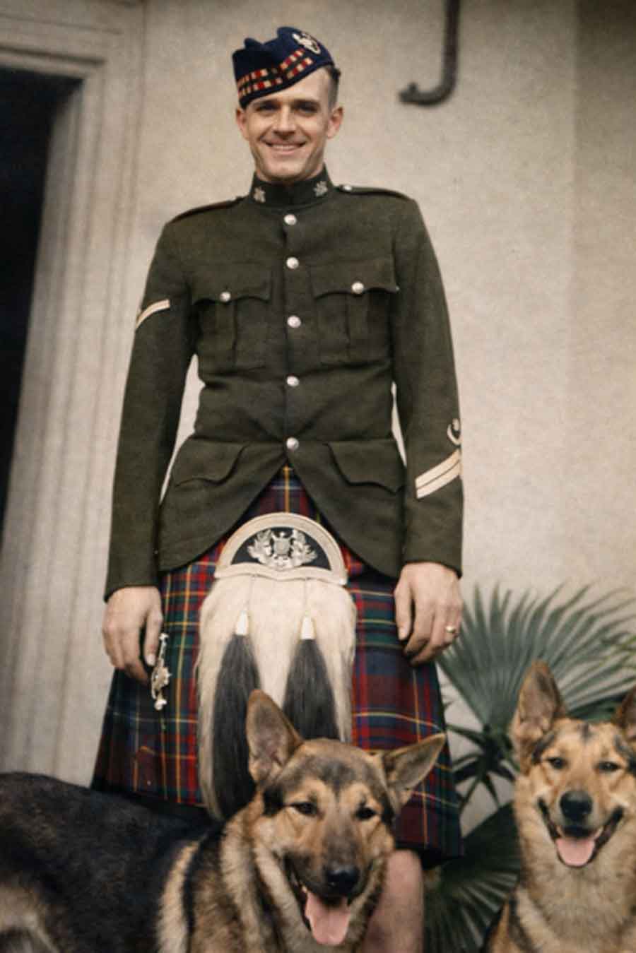 Peter Burnett of the 2nd Battalion Royal Scots with his dogs. Peter was lost in the sinking of the Lisbon Maru