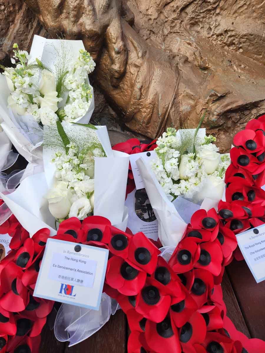Wreaths commemorating the POWs on the Lisbon Maru including one in honour of Thomas Russell laid by his great granddaughter Frances Moore at the Chinese Memorial Qingbang Island, Dongji Town, Zhoushan, East China in May 2026. Thomas Russell was lost in the sinking of the Lisbon Maru.